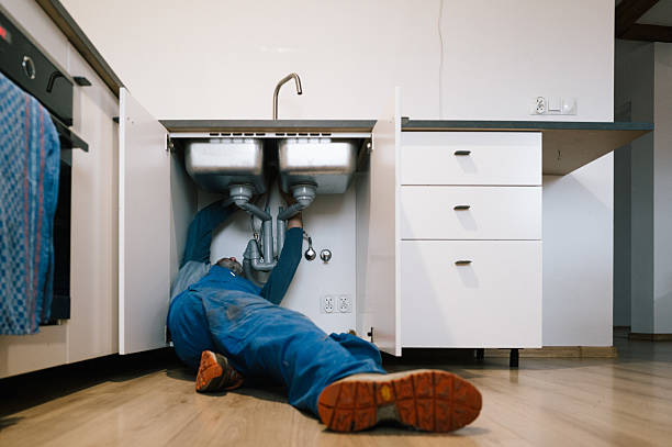 Professional Emergency Plumber technician working in Lake Grove, NY